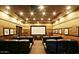 The residential movie theater has tiered seating, sconce lighting, and framed pictures for a cinematic experience at 20100 N 78Th Pl # 2098, Scottsdale, AZ 85255
