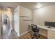 A well-lit office featuring hardwood floors and floating shelves at 20100 N 78Th Pl # 2098, Scottsdale, AZ 85255