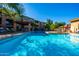 Relaxing pool area with a pergola and lounge chairs for residents to enjoy at 20100 N 78Th Pl # 2098, Scottsdale, AZ 85255