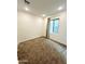 Well-lit bedroom featuring carpet flooring, neutral paint, and a window offering ample natural light at 2079 N Marketside Ave, Buckeye, AZ 85396