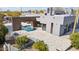 Aerial view of a modern home, pool, and outdoor kitchen featuring desert surroundings at 24201 N 87Th St, Scottsdale, AZ 85255