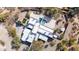 Aerial view of a modern home layout including the backyard pool, outdoor kitchen and desert landscaping at 24201 N 87Th St, Scottsdale, AZ 85255