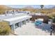 A landscape view of a modern home showing pool, desert landscaping and mountain views at 24201 N 87Th St, Scottsdale, AZ 85255