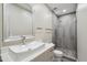 Well-lit bathroom with a modern vanity, vessel sink, and a glass-enclosed shower at 24201 N 87Th St, Scottsdale, AZ 85255
