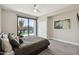 Cozy bedroom featuring a ceiling fan and a sliding door to an outdoor living space at 24201 N 87Th St, Scottsdale, AZ 85255