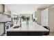 Bright kitchen featuring an island with a sink, stainless steel appliances, and modern finishes at 24201 N 87Th St, Scottsdale, AZ 85255