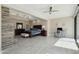 This well-lit main bedroom features hardwood floors, a ceiling fan, and a workspace next to a bright window at 24201 N 87Th St, Scottsdale, AZ 85255