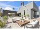 Modern outdoor patio with sleek furniture, potted plants, and view of the pool at 24201 N 87Th St, Scottsdale, AZ 85255