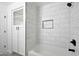 Bathroom features a large tiled shower with built-in shelving and storage cabinet at 25073 W Dove Trl, Buckeye, AZ 85326