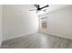 Comfortable bedroom featuring tile flooring, ceiling fan, and natural light at 25073 W Dove Trl, Buckeye, AZ 85326