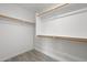 Spacious walk-in closet with installed shelving for maximum organization and storage at 25073 W Dove Trl, Buckeye, AZ 85326