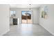 Open dining area with stainless appliances and a sliding door to the backyard at 25073 W Dove Trl, Buckeye, AZ 85326