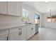 Beautiful kitchen with stainless steel appliances and white cabinetry open to dining area at 25073 W Dove Trl, Buckeye, AZ 85326