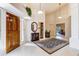 Grand entryway with high ceilings, a wood door, and a stylish rug creating a welcoming atmosphere at 25628 N Cordova Ln, Rio Verde, AZ 85263