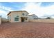 Backyard featuring rock landscaping and a view of the home's exterior at 25724 W St James Ave, Buckeye, AZ 85326