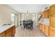 Bright dining area adjacent to kitchen features tile floors and backyard access at 25724 W St James Ave, Buckeye, AZ 85326