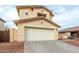 Inviting two-story home featuring a spacious two-car garage and a well-maintained, low maintenance landscape at 25724 W St James Ave, Buckeye, AZ 85326