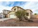 Charming two-story home with a spacious two-car garage and attractive, low maintenance desert landscaping at 25724 W St James Ave, Buckeye, AZ 85326