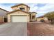 Inviting two-story home featuring a spacious two-car garage and a well-maintained, low maintenance landscape at 25724 W St James Ave, Buckeye, AZ 85326