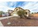 Charming two-story home with a spacious two-car garage and attractive, low maintenance desert landscaping at 25724 W St James Ave, Buckeye, AZ 85326