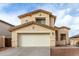 Inviting two-story home featuring a spacious two-car garage and a well-maintained, low maintenance landscape at 25724 W St James Ave, Buckeye, AZ 85326