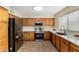 Spacious kitchen featuring stainless steel appliances, light countertops, and tile flooring at 25724 W St James Ave, Buckeye, AZ 85326