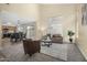 Inviting living room featuring high ceilings, neutral tones, and an open floor plan at 25724 W St James Ave, Buckeye, AZ 85326