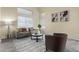 Cozy living room featuring large windows and neutral decor at 25724 W St James Ave, Buckeye, AZ 85326
