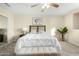 Tranquil main bedroom with neutral tones, ceiling fan, and comfortable furnishings at 25724 W St James Ave, Buckeye, AZ 85326