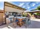 Enjoy outdoor living with this covered kitchen, BBQ, TV, and bar seating at 2728 W Adventure Dr, Anthem, AZ 85086