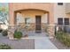 Charming front entry with stone accents, well manicured landscaping, and covered porch at 2821 S Skyline Dr # 169, Mesa, AZ 85212