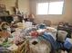 A messy bedroom with lots of boxes and furniture at 3002 W Mandalay Ln, Phoenix, AZ 85053