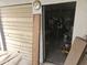 View into a messy garage featuring a roll-up door, and abundant space for storage and projects at 3002 W Mandalay Ln, Phoenix, AZ 85053