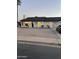 Charming single-story home boasts a well-maintained exterior with a black roof and a xeriscape front yard at 3345 E Edgewood Ave, Mesa, AZ 85204