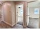Hallway entrance to bedrooms with new flooring and fixtures at 3345 E Edgewood Ave, Mesa, AZ 85204
