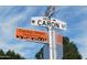 Neighborhood sign for Cactus Wren at the intersection of W Caron St and 29th Ave, with a clear blue sky at 3817 W Caron St, Phoenix, AZ 85051