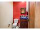 Bathroom with a colorful wall, dark vanity, and toilet at 4115 E Ashler Hills E Dr, Cave Creek, AZ 85331