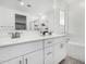 Bright bathroom featuring double sinks, white cabinets, a bathtub, and a separate shower at 4402 W Bush Bean Way, San Tan Valley, AZ 85144