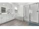 Bathroom showcasing a double vanity, soaking tub, and glass shower at 4402 W Bush Bean Way, San Tan Valley, AZ 85144