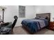 Comfortable bedroom with a dark-colored bed frame and matching furniture at 4402 W Bush Bean Way, San Tan Valley, AZ 85144