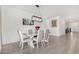 Elegant dining room featuring a marble table, seating for six, and modern lighting at 4402 W Bush Bean Way, San Tan Valley, AZ 85144