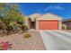 Charming single-story home with desert landscaping, a red garage door, and a matching front door at 4402 W Bush Bean Way, San Tan Valley, AZ 85144