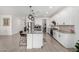 Bright kitchen featuring an island with bar seating, stainless appliances, and ample storage space at 4402 W Bush Bean Way, San Tan Valley, AZ 85144