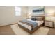 Inviting bedroom with plush bedding, soft rug, and stylish decor, creating a relaxing ambiance at 4609 S 122Nd S Dr, Avondale, AZ 85323