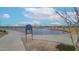 Scenic community fishing water with paved walking path and covered gazebo, perfect for relaxation and outdoor enjoyment at 4609 S 122Nd S Dr, Avondale, AZ 85323