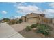 Desert landscaping adds appeal to this single Gathering house with brick paver driveway and easy access to walking paths at 4609 S 122Nd S Dr, Avondale, AZ 85323