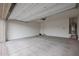Spacious garage with an automatic door and water heater at 4609 S 122Nd S Dr, Avondale, AZ 85323