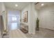 Bright, neutral hallway with tile flooring and decorative accents leading into the airy living space at 4609 S 122Nd S Dr, Avondale, AZ 85323