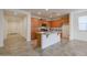 Open-concept kitchen with tile flooring, granite countertops, stainless steel appliances and ample cabinet space at 4609 S 122Nd S Dr, Avondale, AZ 85323