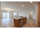 Kitchen island with granite countertops, stainless steel appliances, breakfast bar, and ample storage space at 4609 S 122Nd S Dr, Avondale, AZ 85323